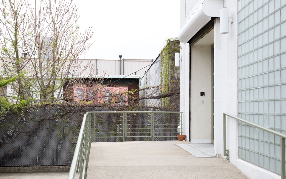 Mike Hewson: (Installation View, painting behind fence) - Entrance to Fisher Landau Centre for Art, 38-27 30th St, Long Island City, NY